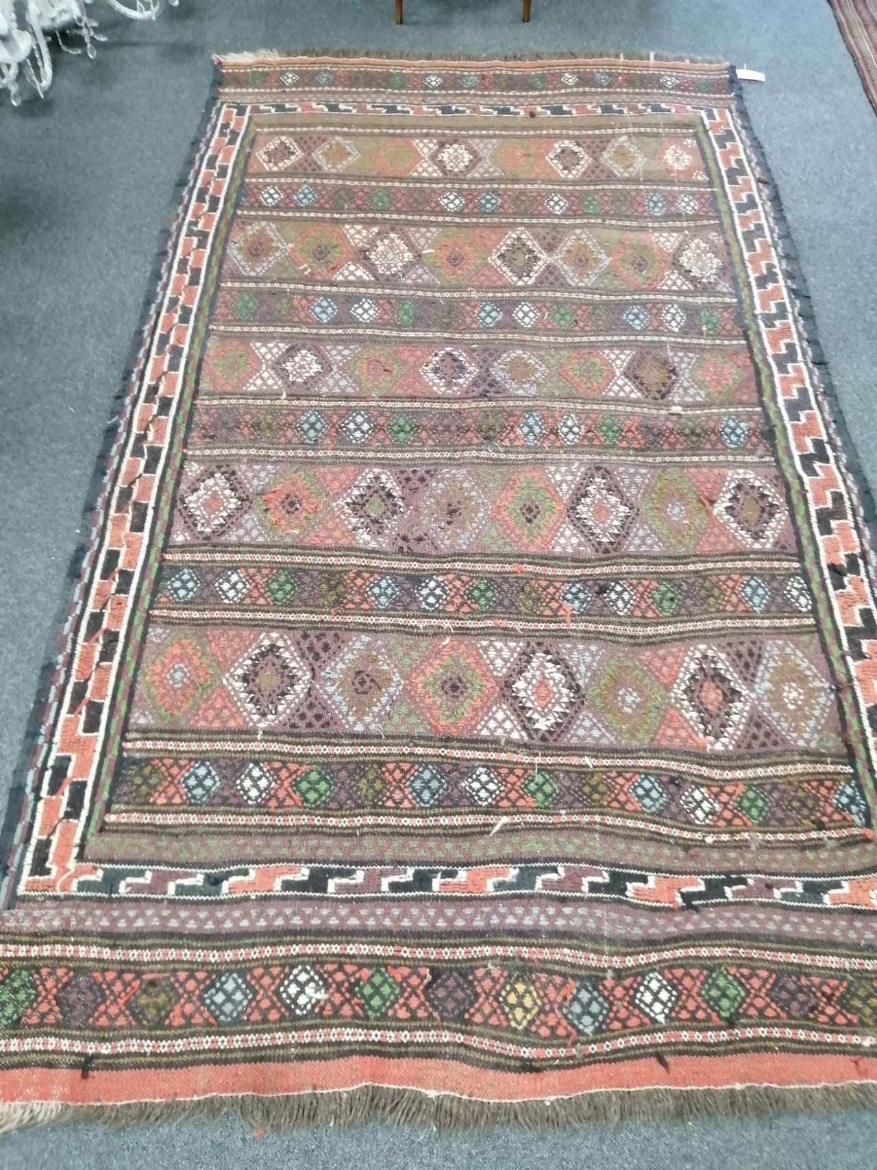 A polychrome flatweave rug, 230 x 130cm